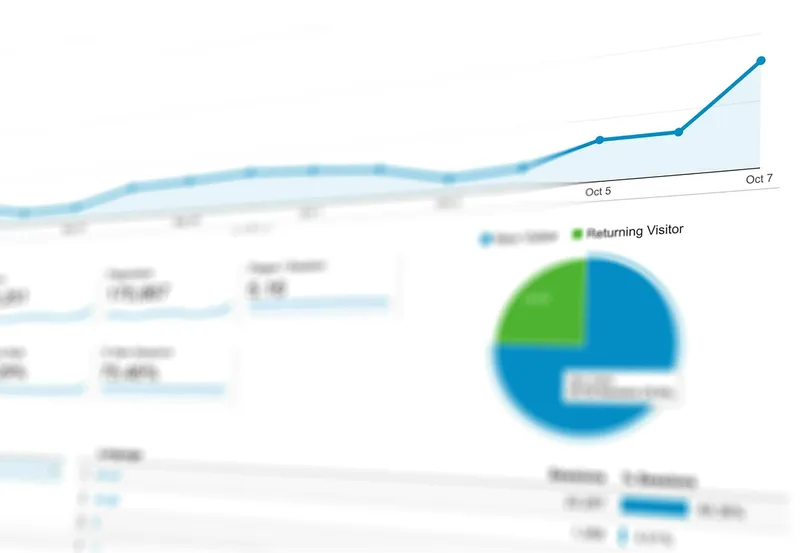 Analytics dashboard on a laptop with graphs and charts — TikTok performance tracking for solo creators