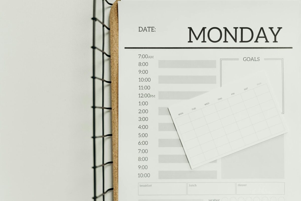 A minimalist weekly planner representing a two-week content buffer schedule for solo creators posting on LinkedIn, Instagram, and YouTube