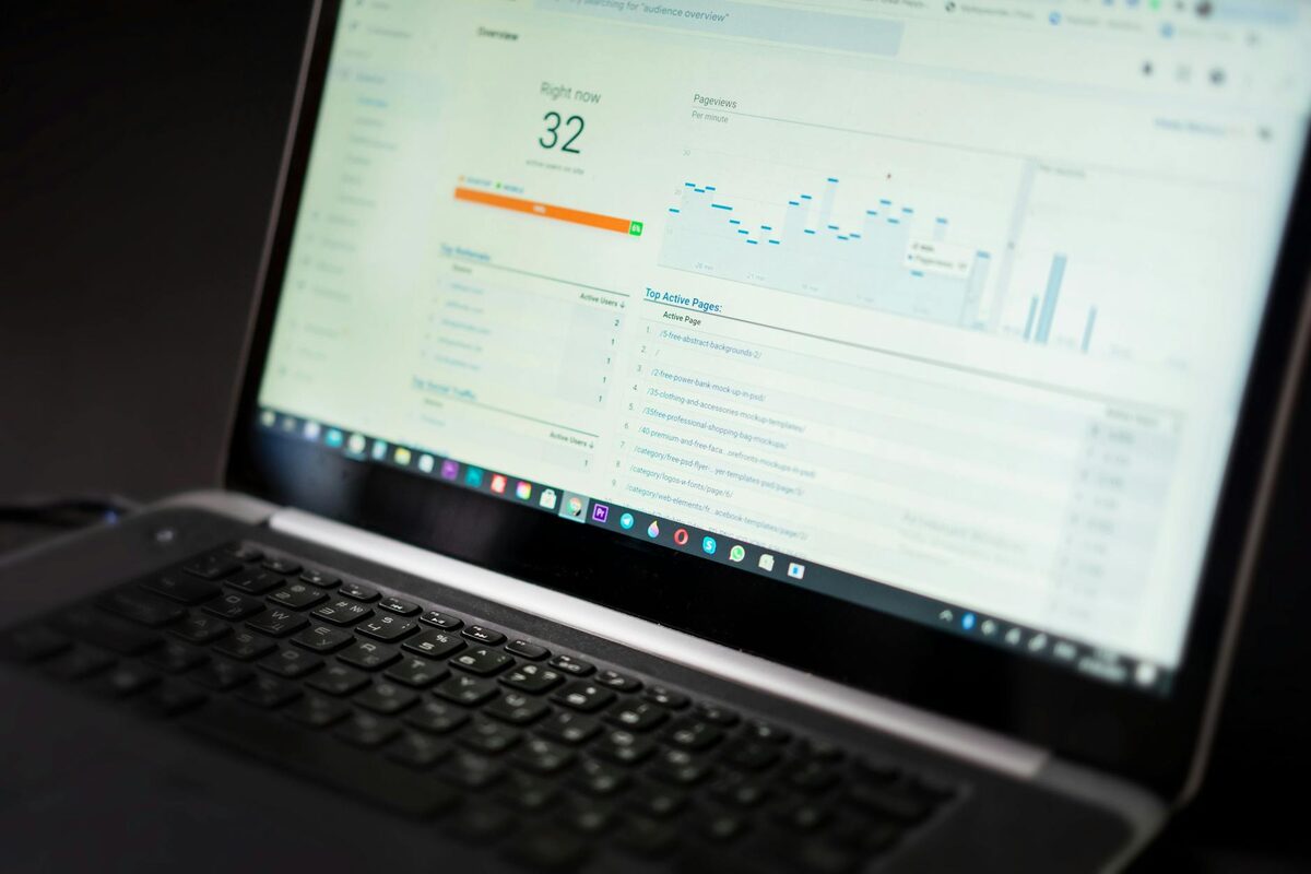 Analytics dashboard on laptop screen showing content performance metrics for a solo creator YouTube channel